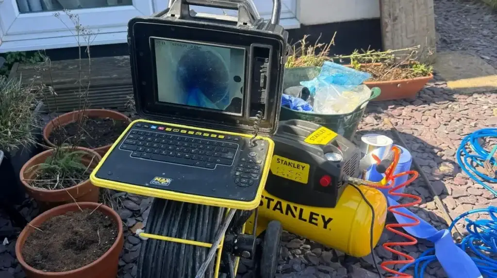 CCTV drain camera and compressor set up in a back garden for a no-dig drain repair in Swindon & Wiltshire